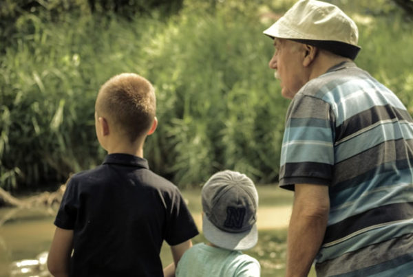 Grandpa plays with his two grandkids