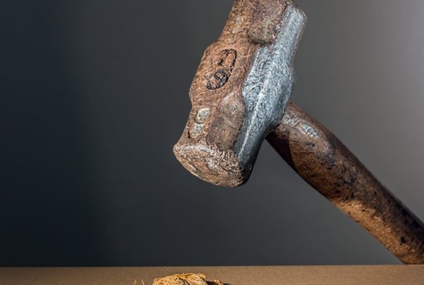 Image of hammer htting a nut, illustrating how financial planning can go wrong with independent financial advice from an adviser in Lincoln