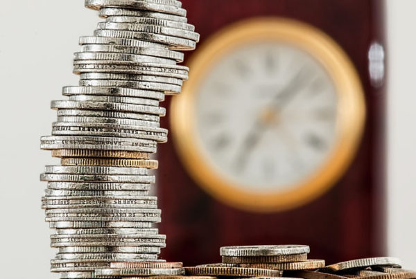 A tower of coins, illustrating precariousness in financial planning without the help of a qualified IFA in Newark or elsewhere